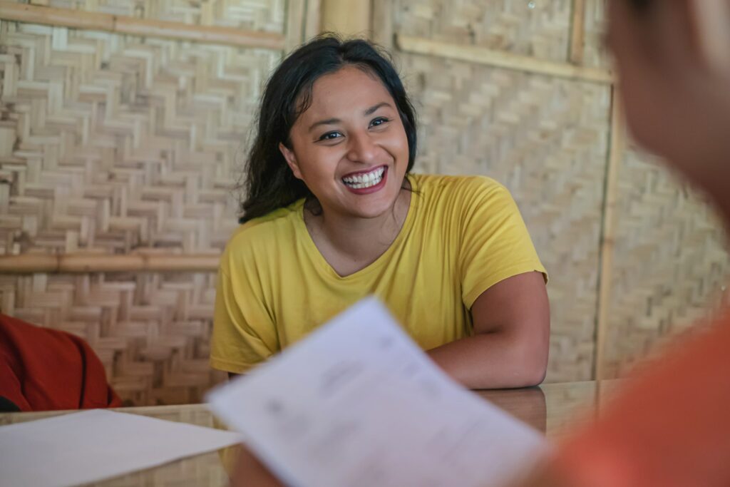 woman smiling with documents